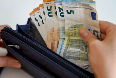 taking money out of wallet